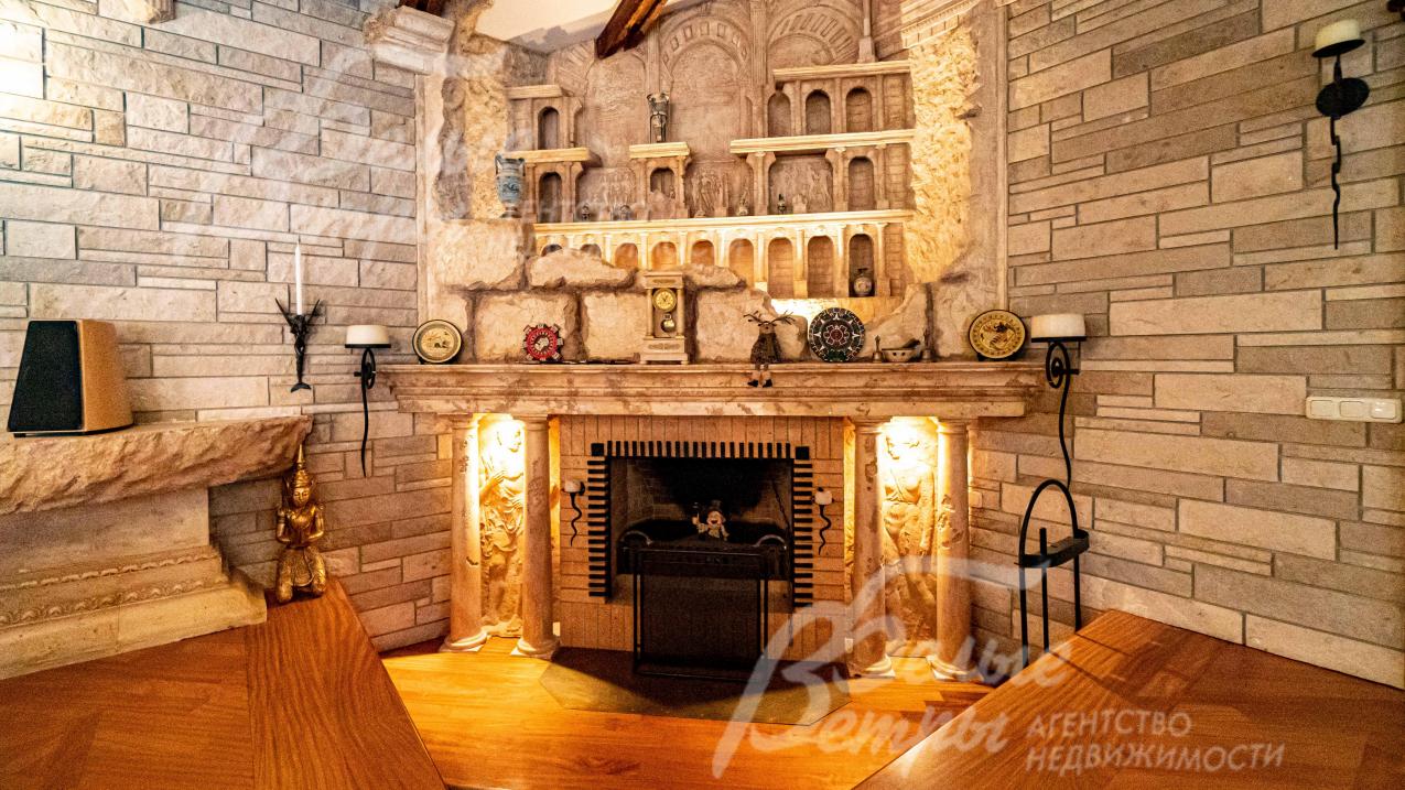 Камин и ТВ группа исполнены и спроектированы известным архитектором Тотаном Кузембаевым